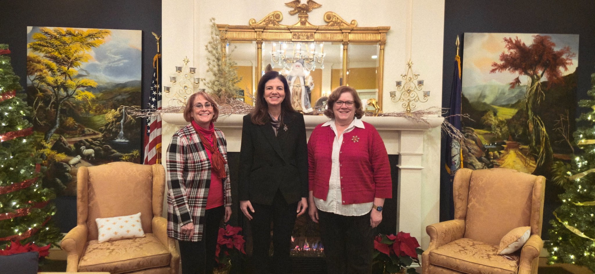 Sharon Carson with two colleagues at a holiday reception