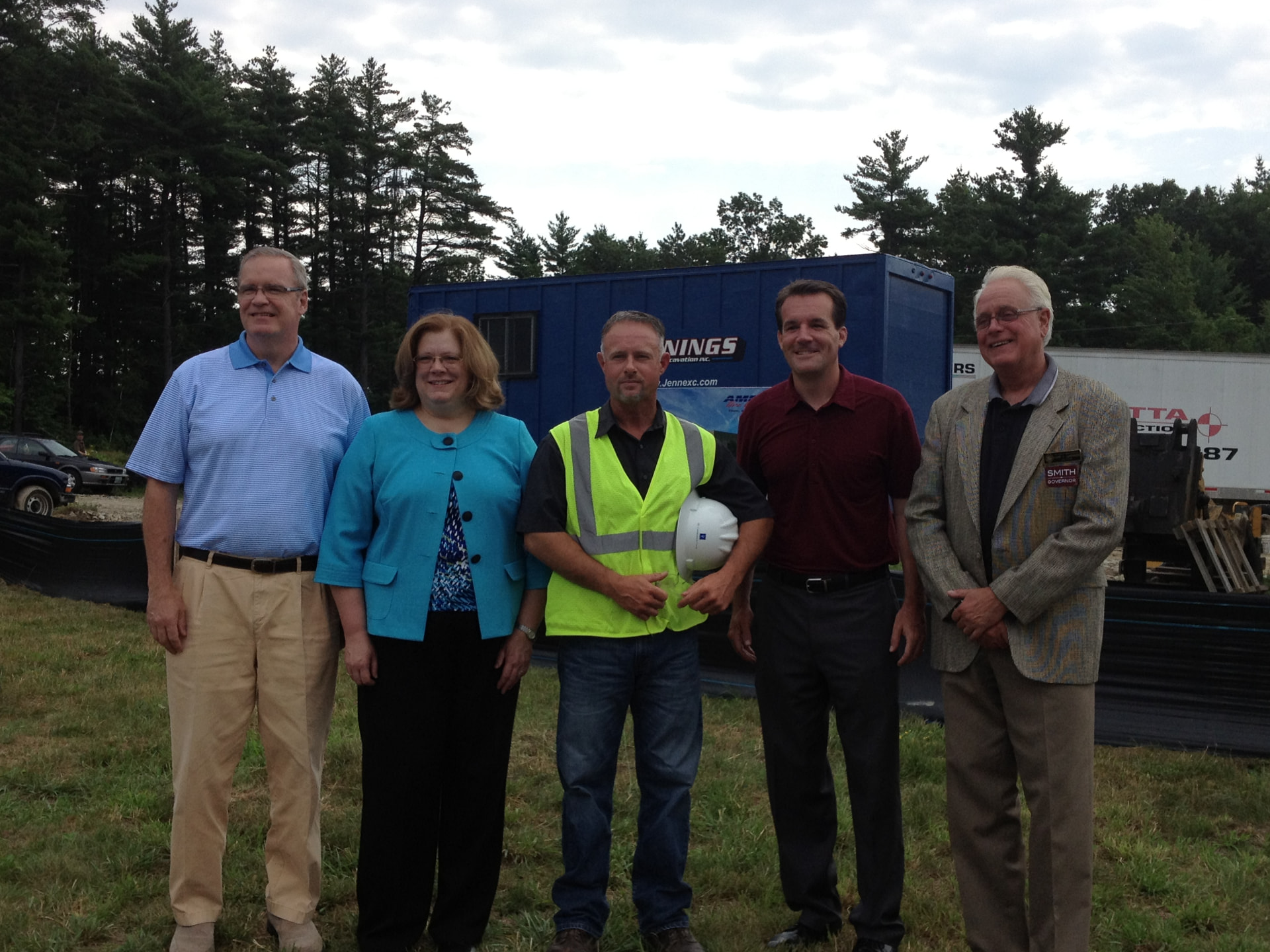 Sharon Carson with local officials and workers at a construction site